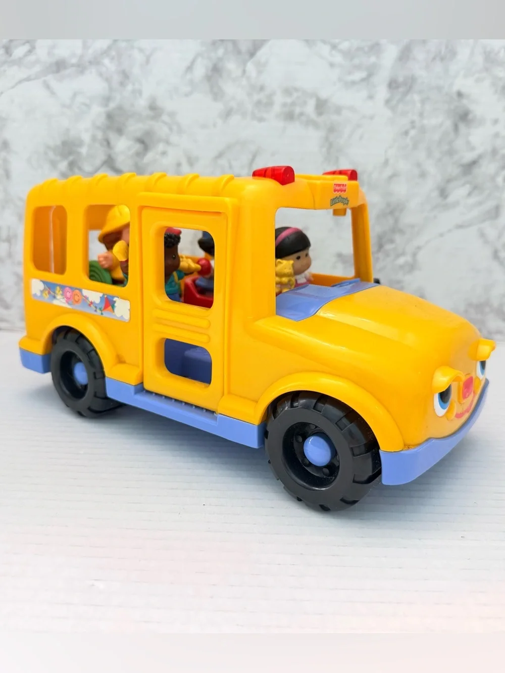 Vintage Fisher-Price Little People bus with 4 figures
